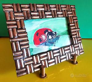 cornice artigianale in ottone