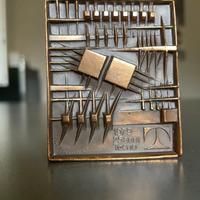 Arnaldo Pomodoro scultura/medaglia in bronzo