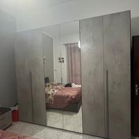 Camera da letto e parete attrezzata