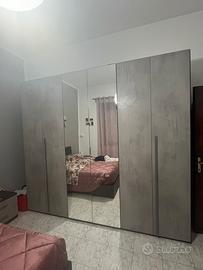 Camera da letto e parete attrezzata
