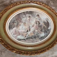 Coppia di stampe artistiche in cornici ovali dorat