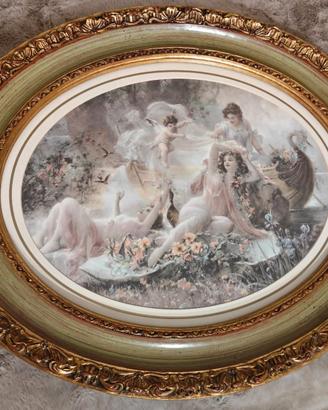 Coppia di stampe artistiche in cornici ovali dorat