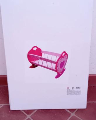 Culla rosa in legno per bambole