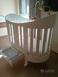 culla ovale in legno con accessori