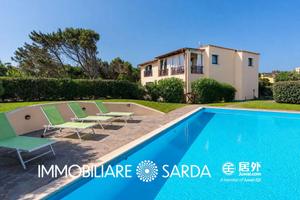 Appartamento con giardino e piscina condominiale -