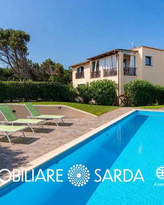 Appartamento con giardino e piscina condominiale -