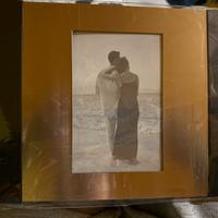 Cornice in metallo oro e nero