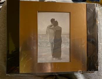 Cornice in metallo oro e nero