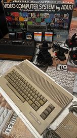 ATARI 2600 + COMMODORE 64 con scatole e giochi ori