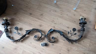 Antichi bracci porta ceri  ferro battuto 