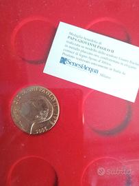 una medaglia metallo placcato oro