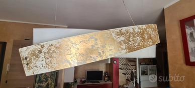 Lampadari Gea Luce in foglia oro.