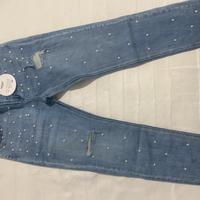 Jeans strappi e perline