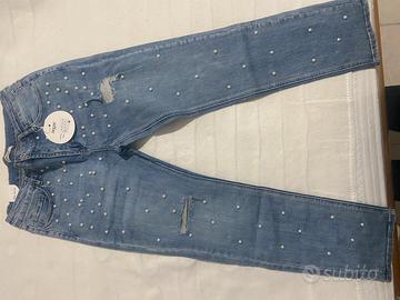 Jeans strappi e perline