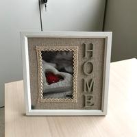 Cornice bianca con scritta home 10x15