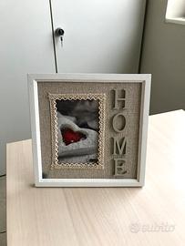 Cornice bianca con scritta home 10x15