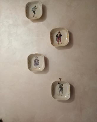 Set di quattro piatti decorativi da parete 