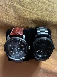Due orologi Guess fossil