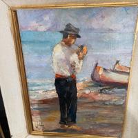 Pescatore  e barc sulla riva