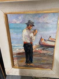 Pescatore  e barc sulla riva