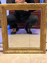 Specchio antico con cormice