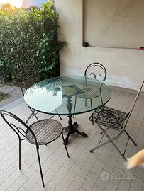 Tavolo rotondo da esterno in vetro con sedie