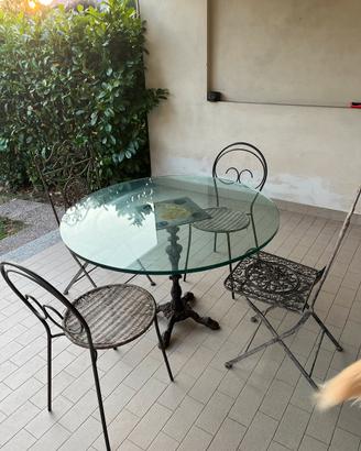 Tavolo rotondo da esterno in vetro con sedie