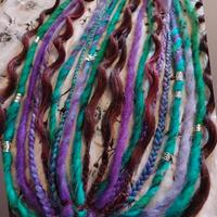 Afroelastici con trecce e dreadlocks