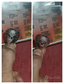 Plettro originale lanciato ad un concerto Slayer