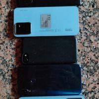telefoni con schermi rotti e un IPHONE bloccato