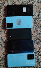 telefoni con schermi rotti e un IPHONE bloccato