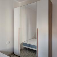 Armadio 4 ante battenti con specchio centrale