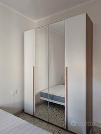 Armadio 4 ante battenti con specchio centrale