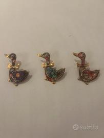 Spille decorative vintage a forma anatroccolo