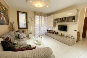 ELEGANTE APPARTAMENTO CON GIARDINO PRIVATO