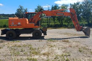 Escavatore gommato Doosan dx 140w