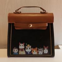 borsa nera con gattini