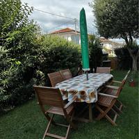 Tavolo da giardino con 6 sedie e ombrellone