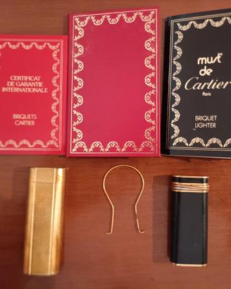 Coppia accendini Must de Cartier Trinity ed Oval