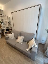 Letto matrimoniale a ribalta con divano