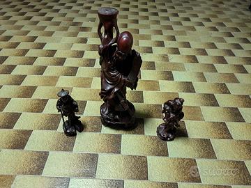 Antiche statue in legno intagliate cinesi