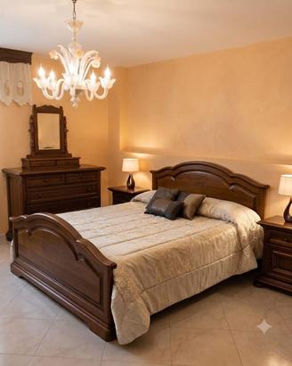 Camera da letto in legno color noce