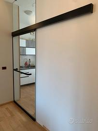 Porta scorrevole in vetro