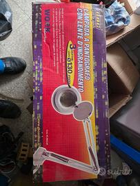 Lampada a pantografo con lente d’ingrandimento