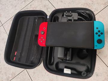 Nintendo switch OLED (blu neon/rosso) con 3 giochi