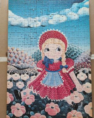 Puzzle con bambina in prato di fiori