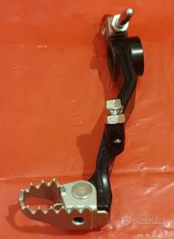 Pedale freno post.+ guarnizione carter + pignone 