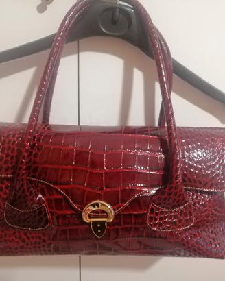 Borsa rossa vernice manici scomparti chiusura 