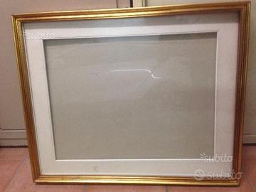 Cornice in legno dorata