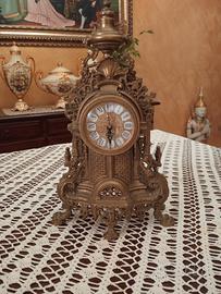 tris candelabri e orologio 
